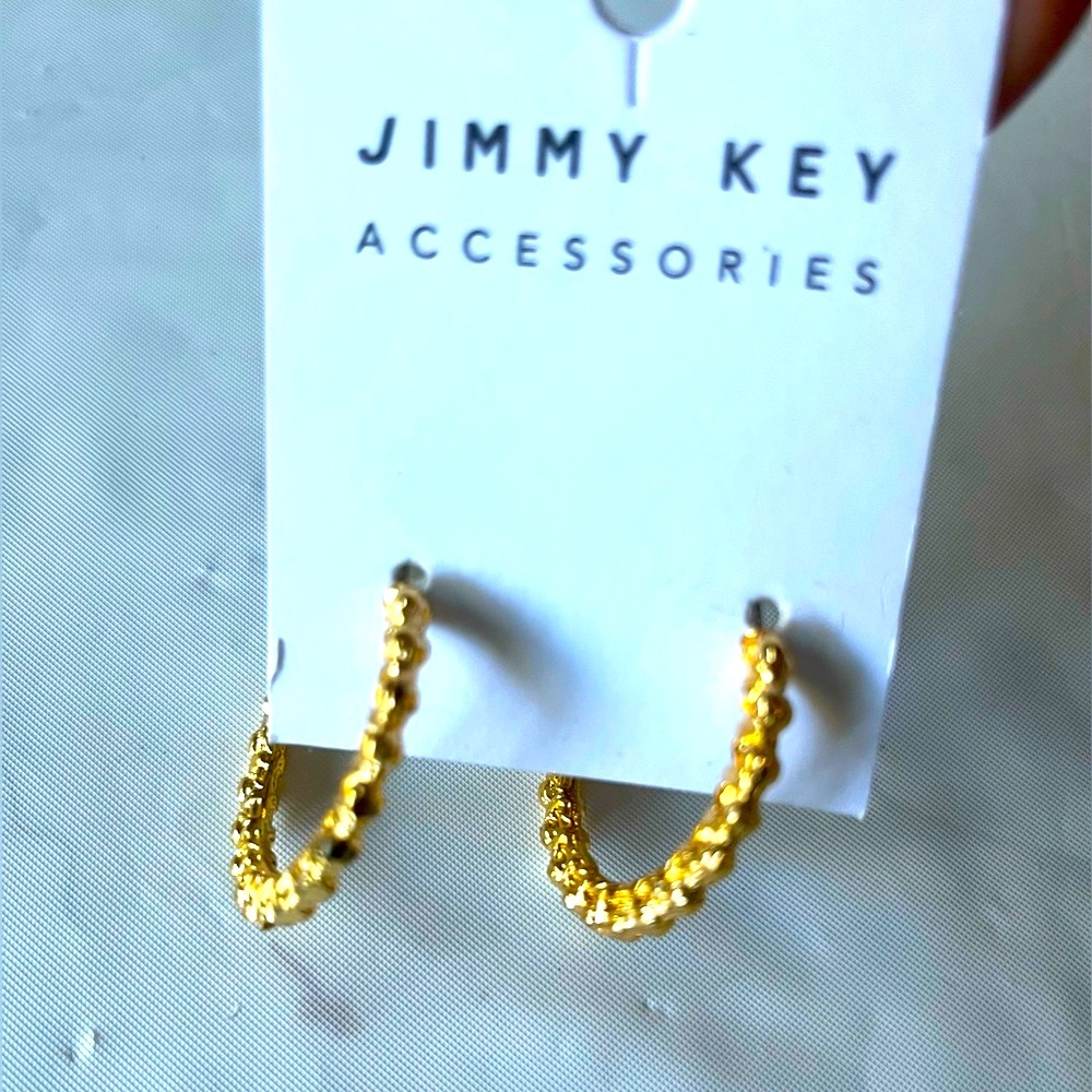 New Jimmy Key designed gold tone round shape earrings .